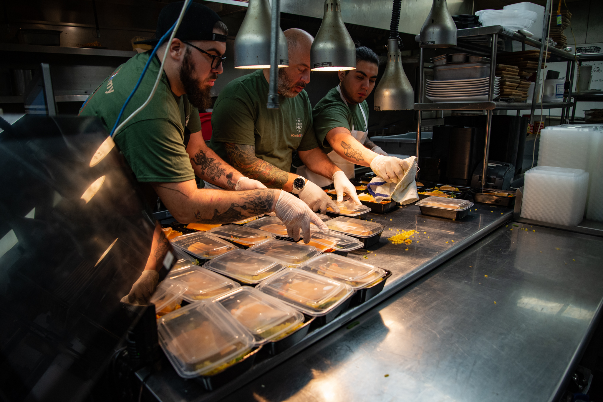 Chef Lou's Army team packing meals in the kitchen